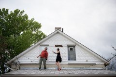 Tara Ryder dancing with a participant on the roof
